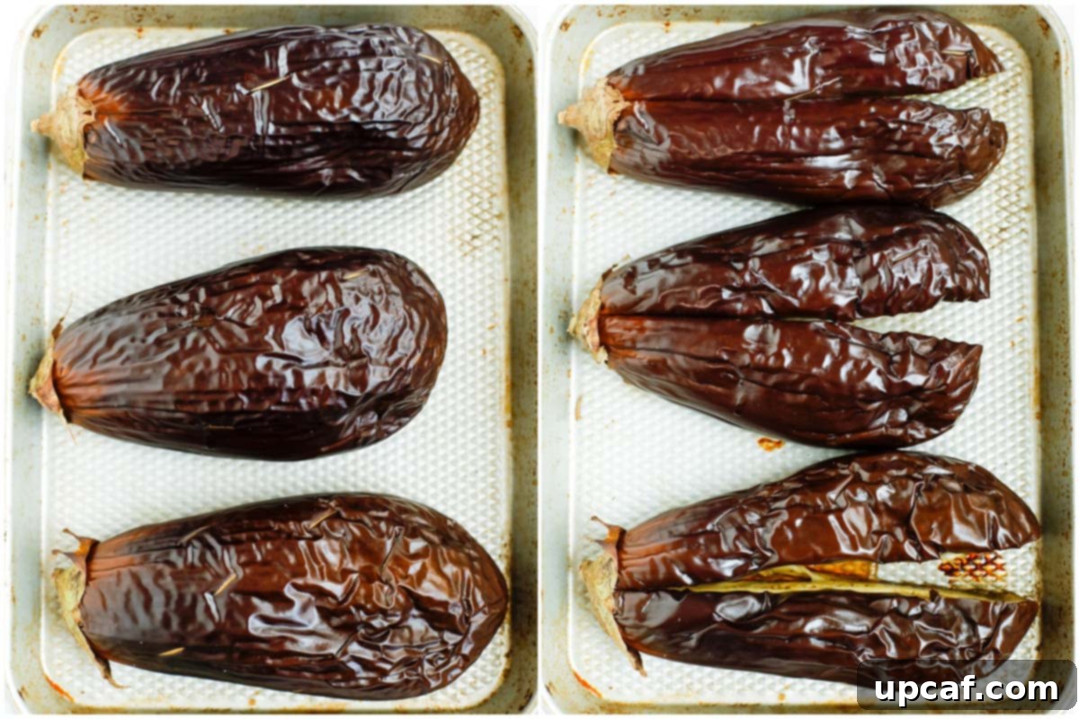 Smoky Lebanese Baba Ganoush 5 A close-up shot of roasted eggplants, with their skins still intact, resting on a baking tray, showcasing their tender texture after being baked.