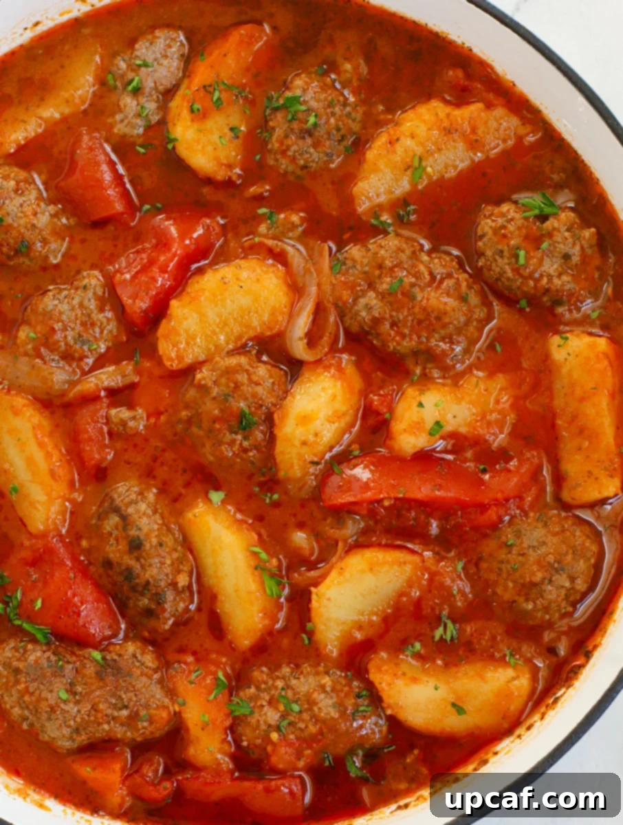 Hearty Kafta and Potato Stew 2 A hearty bowl of Lebanese Kafta and Potato Stew, garnished with fresh parsley.