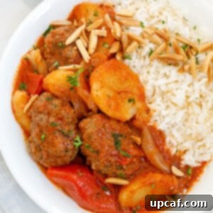 Hearty Kafta and Potato Stew 14 Kafta and potato stew served with vermicelli rice, garnished with fresh herbs.