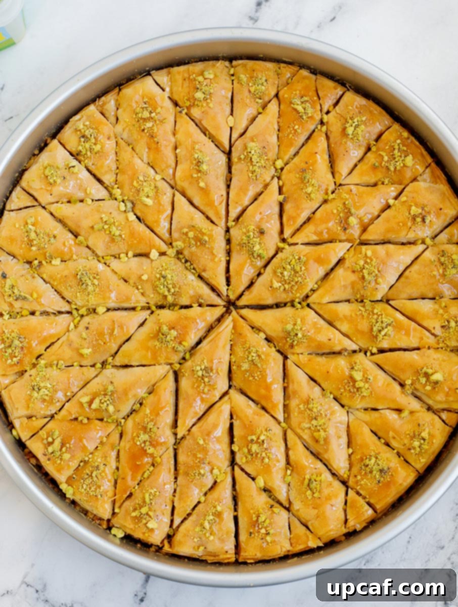 Baked walnut baklava cut into diamond shapes.
