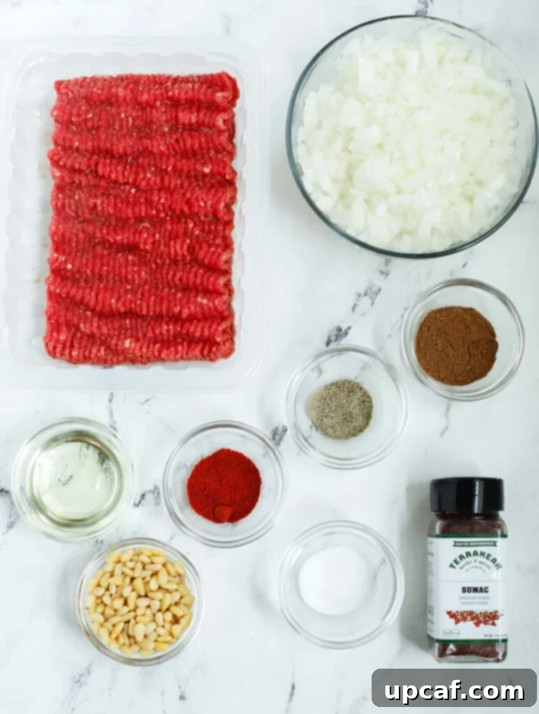 Fresh ingredients for the spiced ground beef filling of Lebanese meat pies.