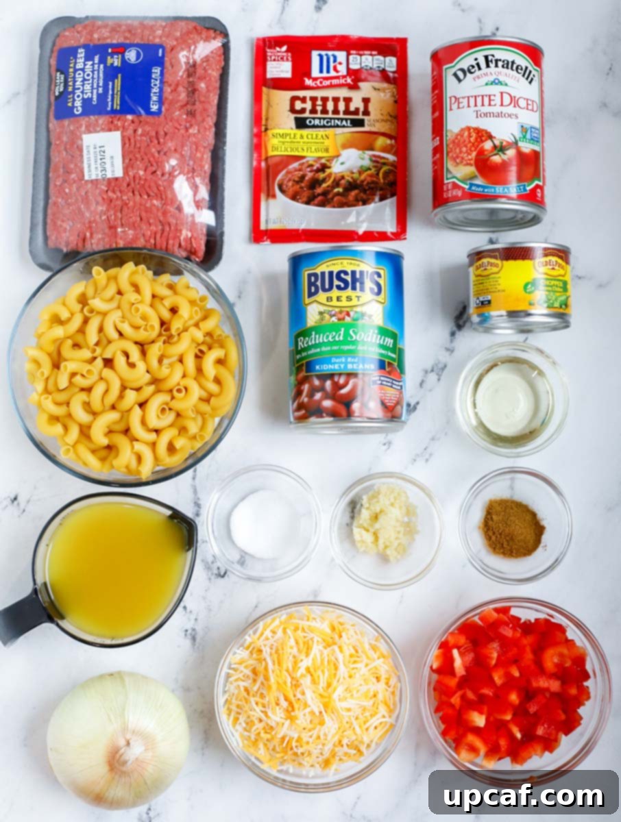 Speedy Cheesy Chili Mac 3 Ingredients needed to make chili mac and cheese, neatly arranged on a counter.
