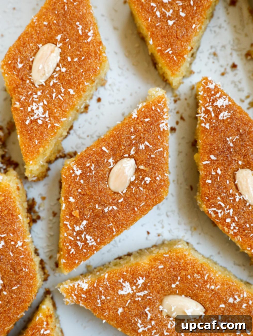 Overhead shot of a beautifully presented Coconut Basbousa cake, freshly made and ready to serve.