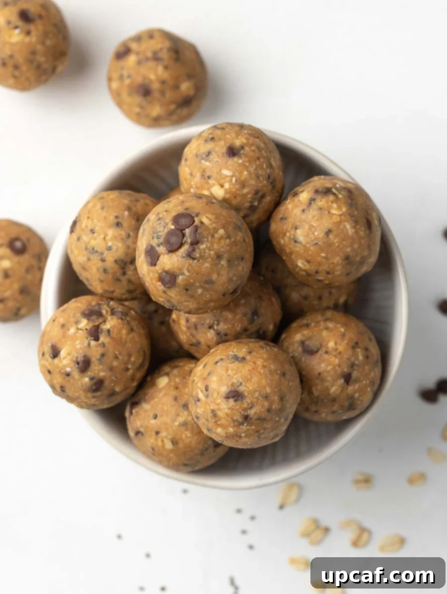 Top-down view of a bowl generously filled with freshly made No-Bake Energy Balls, ready to be enjoyed.