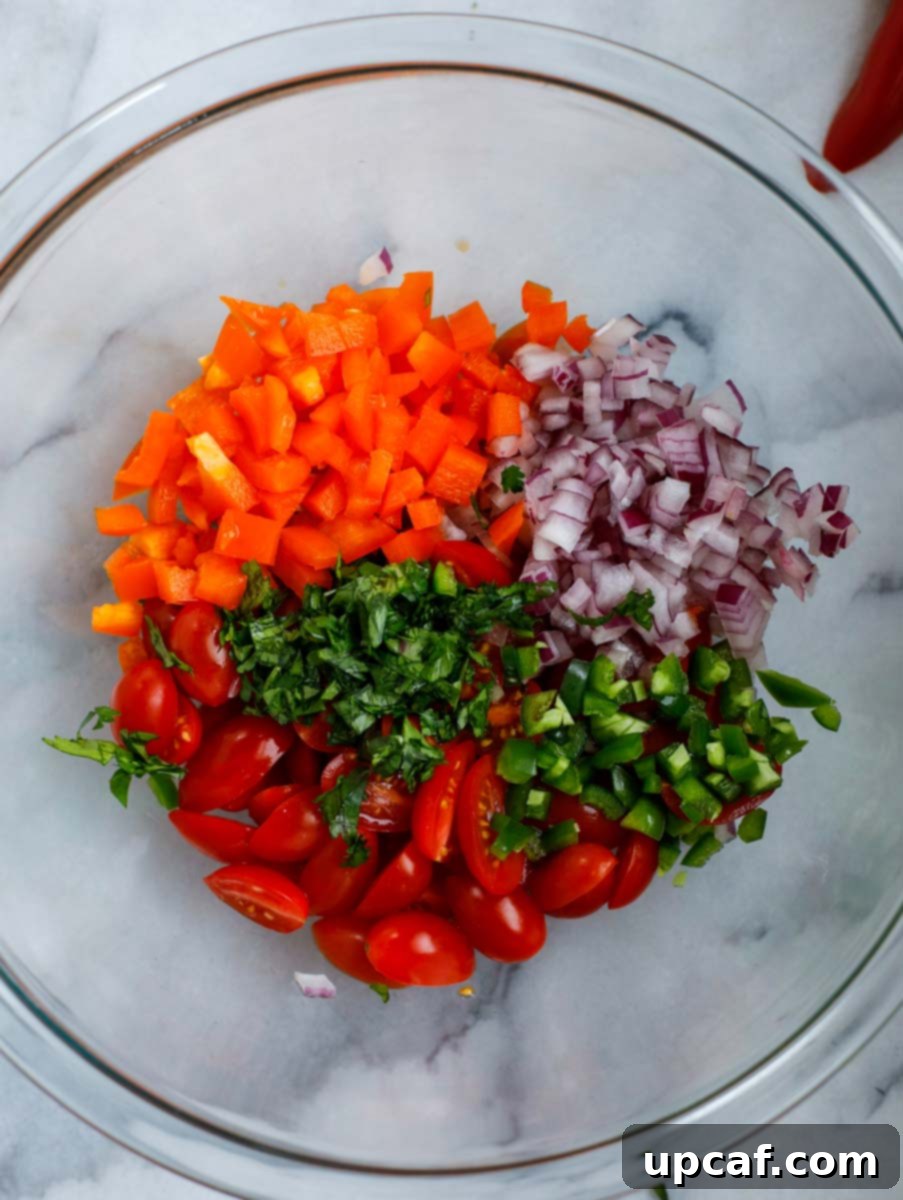 Creamy Avocado Chicken Salad 3 Bowl of the vegetables (tomatoes, bell pepper, pepper, onions, and parsley).