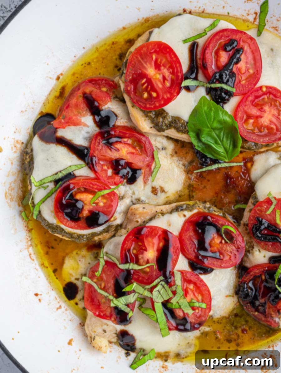 Appetizing top-down shot of the finished Caprese chicken skillet, garnished and ready to serve