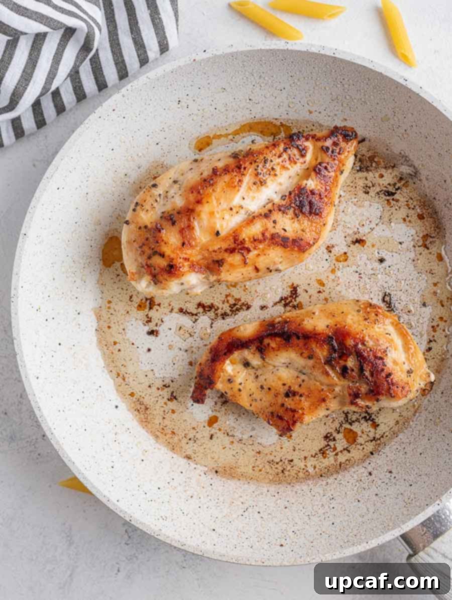 cooked chicken breast on a skillet