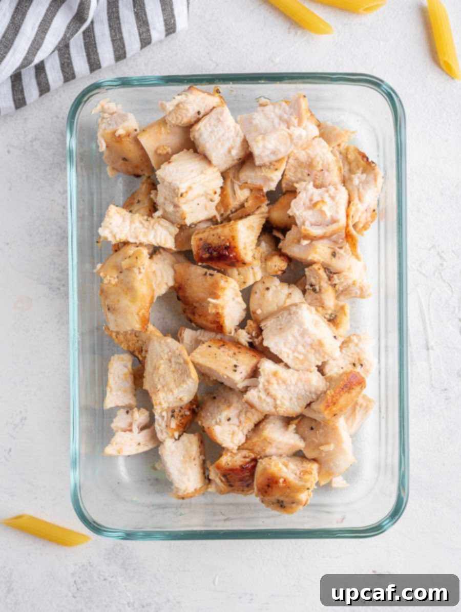 cubed chicken in a glass bowl