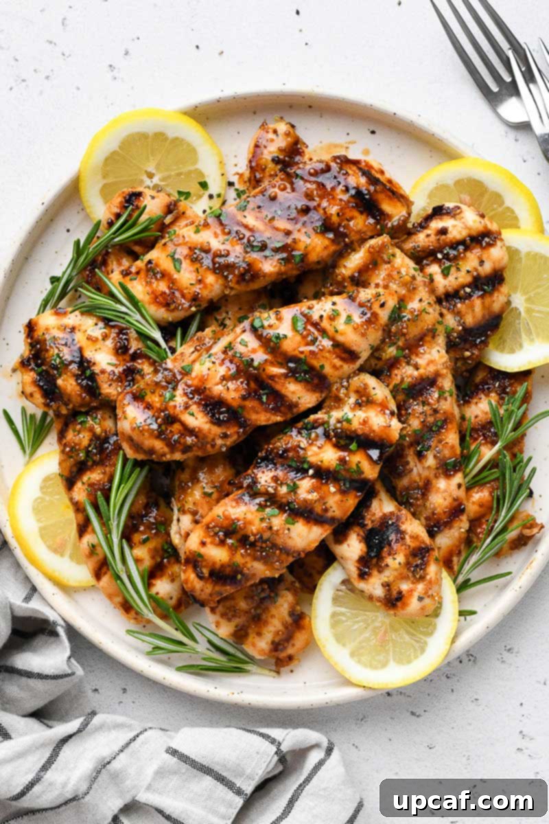 Overhead view of a plate of grilled honey mustard chicken.