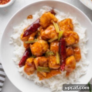 Quick Sticky Mongolian Chicken 11 Mongolian Chicken served over white rice in a bowl