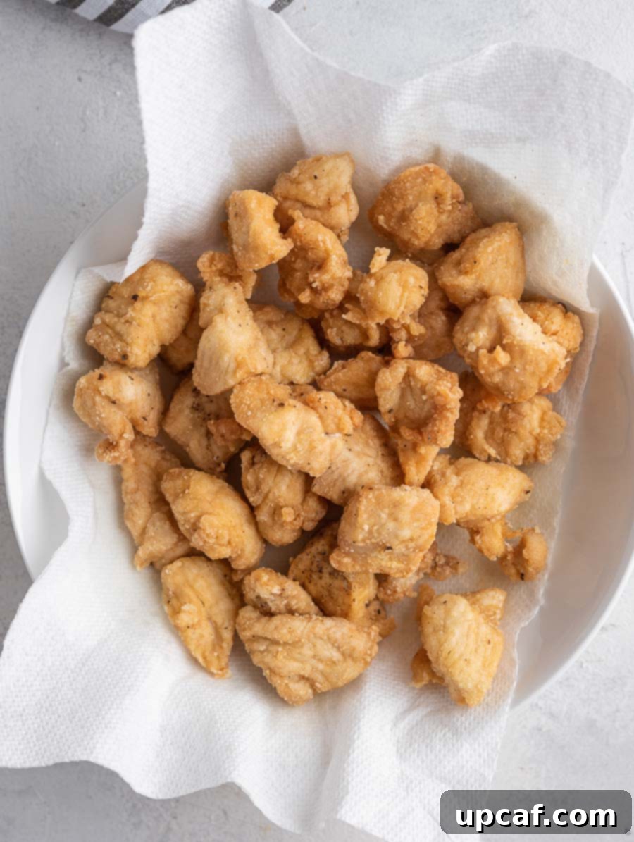 Quick Sticky Mongolian Chicken 6 fried chicken bites in a bowl on a paper towel