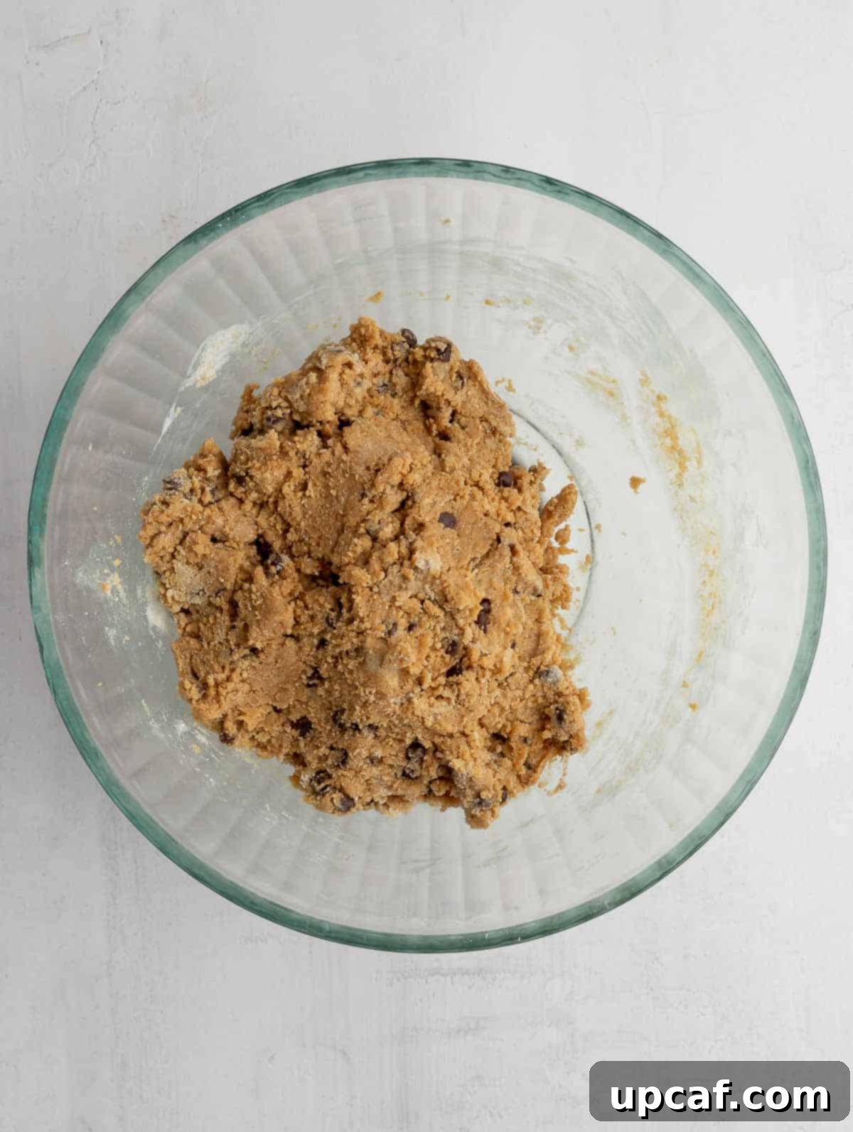 Mixed protein cookie dough in a bowl, showing the perfect consistency after combining all ingredients.
