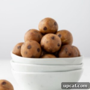 Protein cookie dough balls in a white bowl