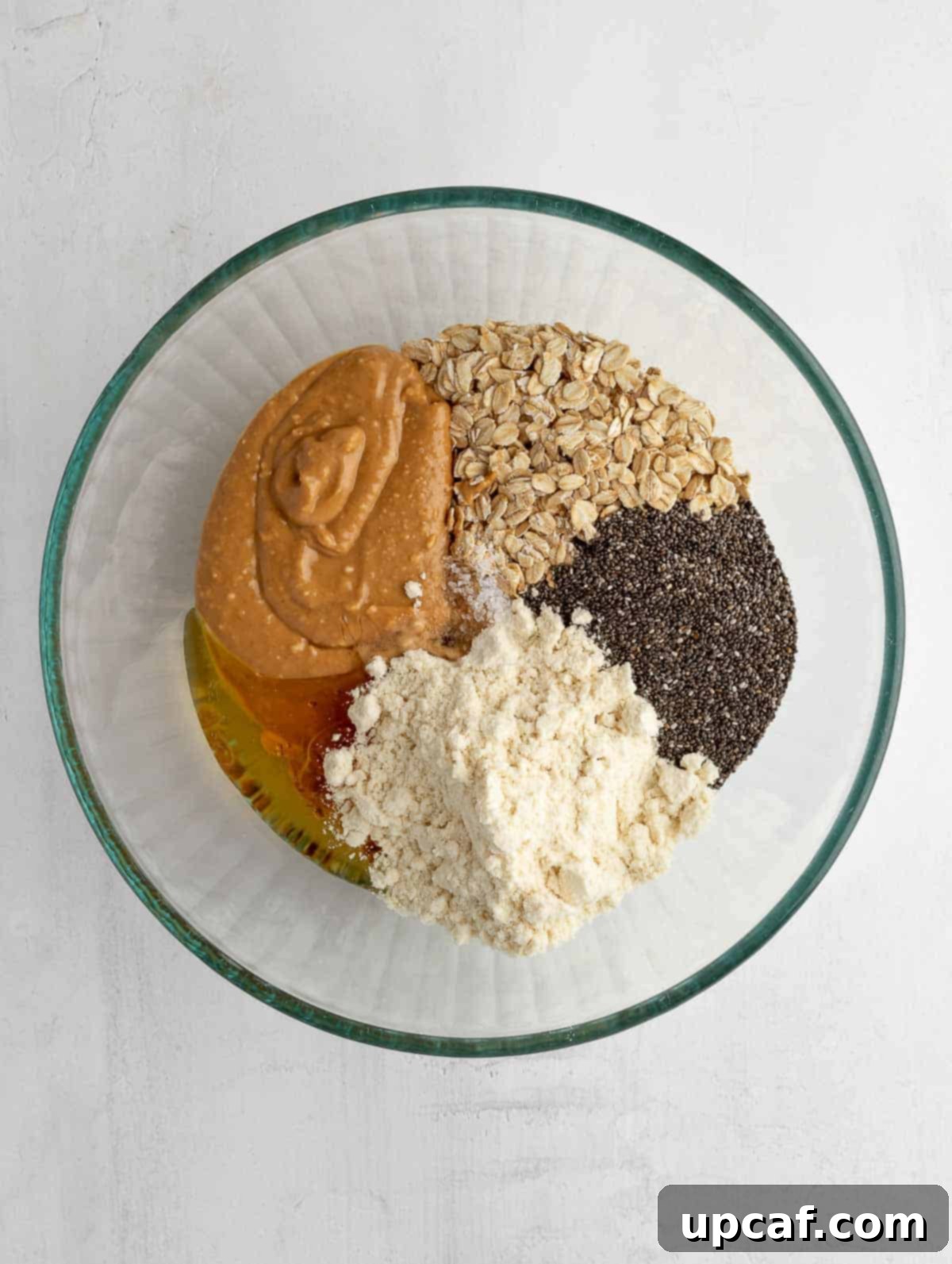 Vanilla Protein Power Bites 4 All dry and wet ingredients for energy balls in a large mixing bowl before mixing