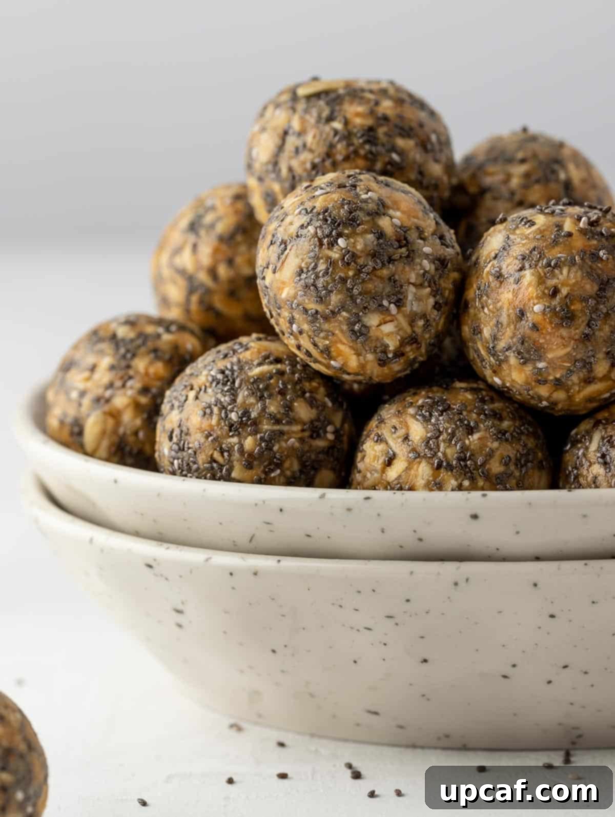 Vanilla Protein Power Bites 7 A collection of vanilla protein energy balls in a white ceramic bowl, ready to serve