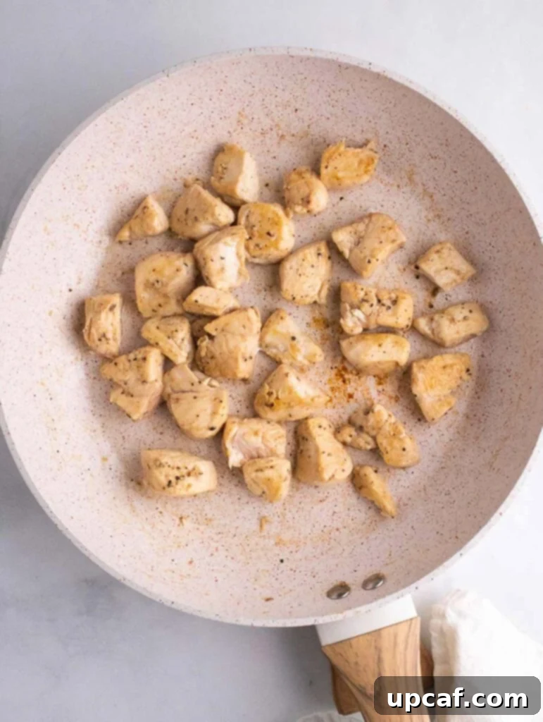 cooked chicken cubes in a skillet