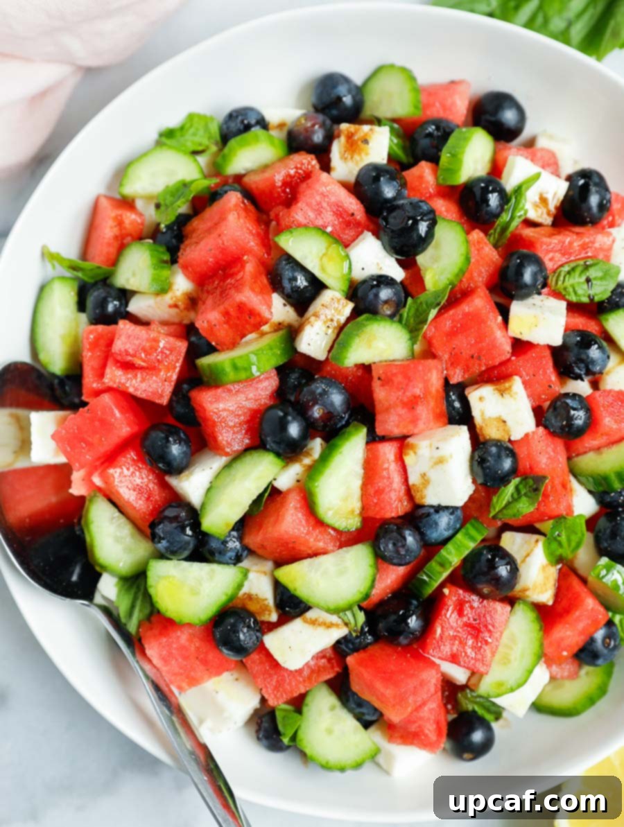top down shot of the watermelon feta salad in a white bowl