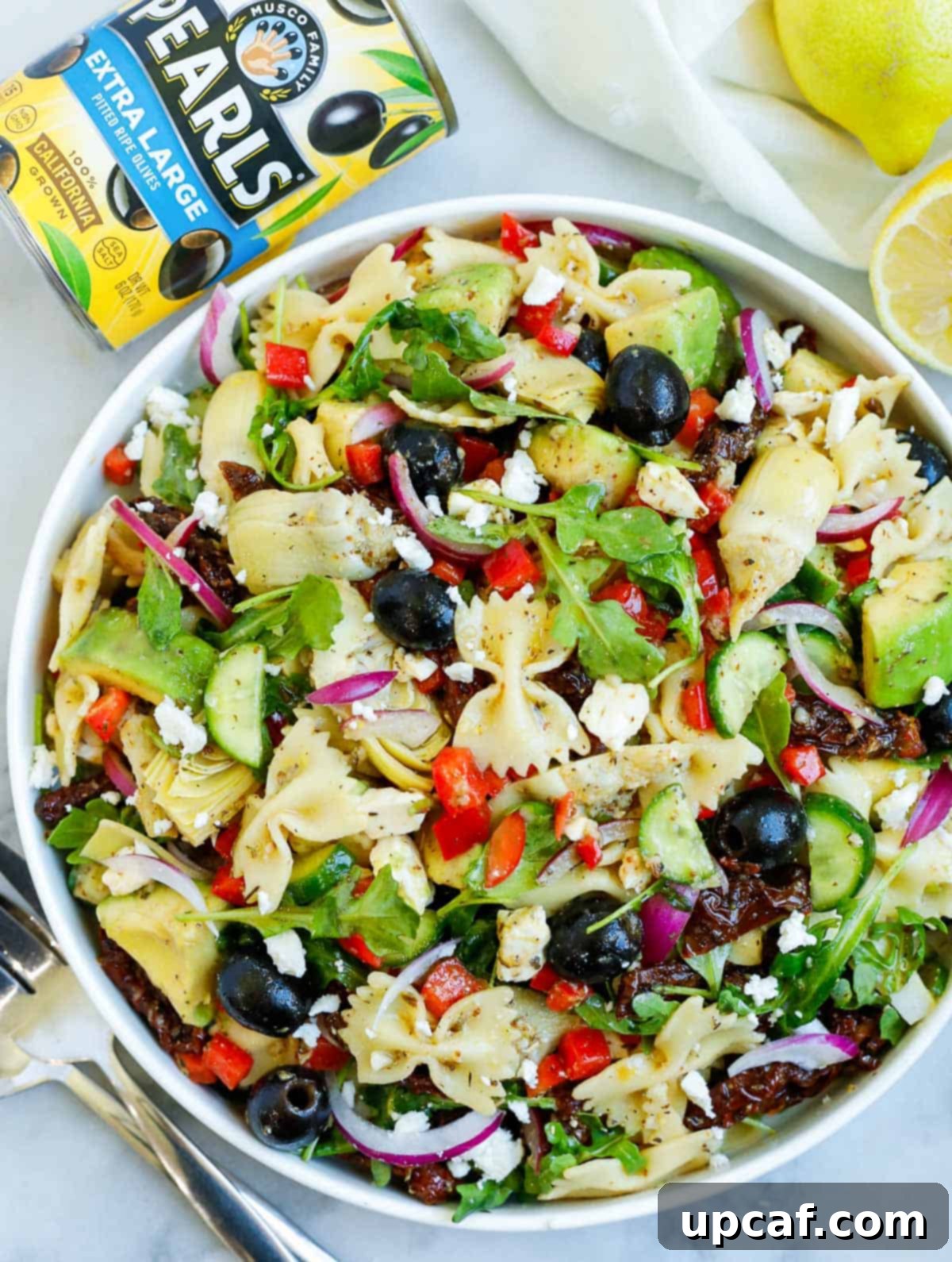 An inviting overhead view of a vibrant lemon herb Mediterranean pasta salad, ready to be enjoyed.