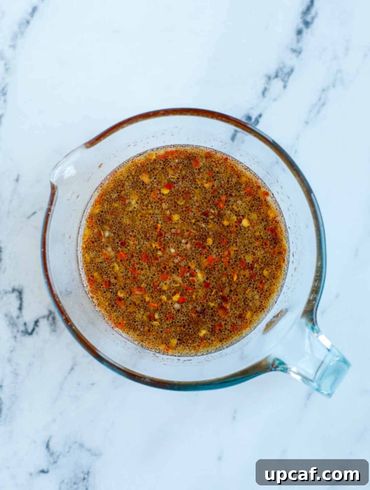 Sweet & Sticky Teriyaki Salmon 4 Bowl of freshly made teriyaki sauce with ingredients like ginger, garlic, and orange.