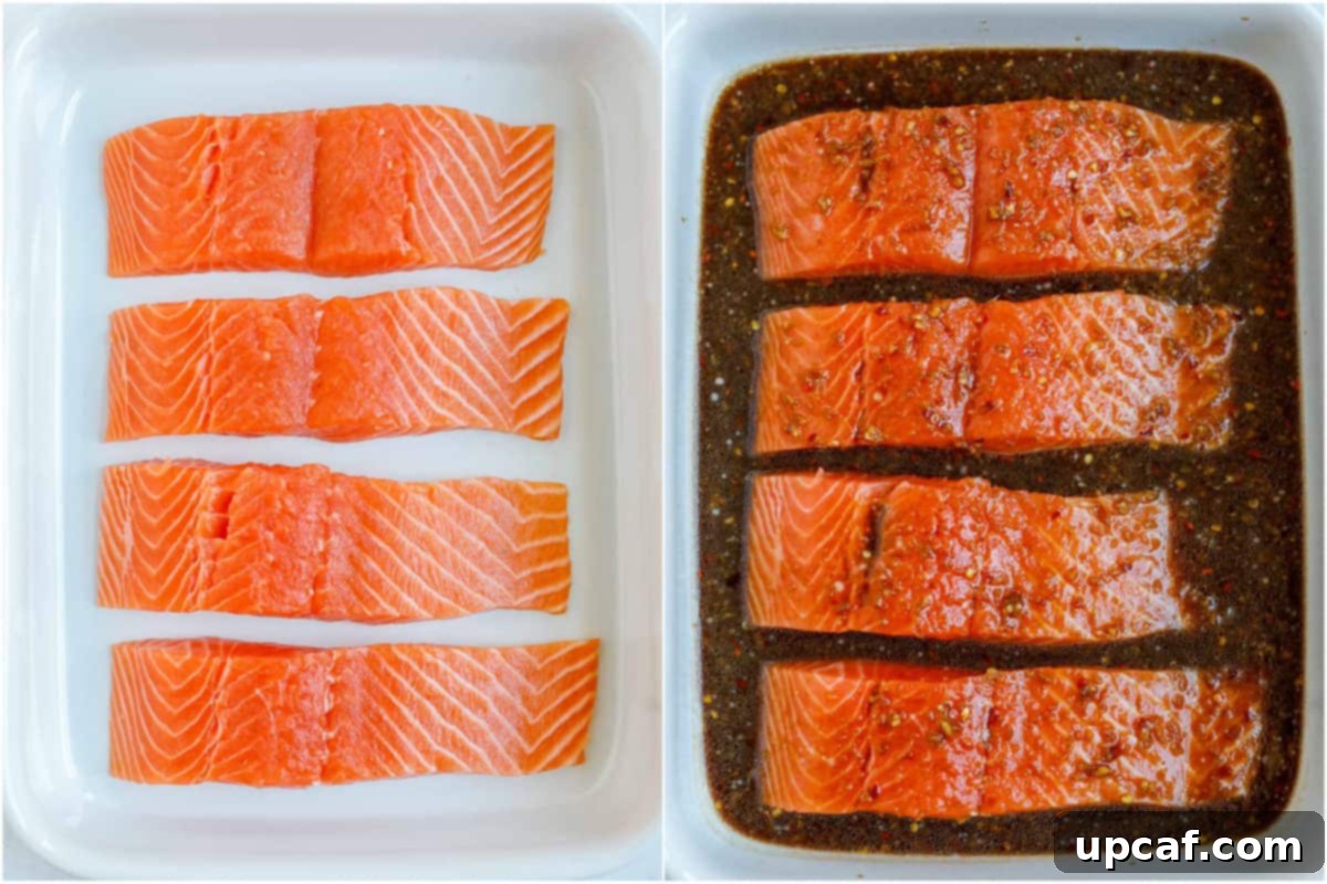 Sweet & Sticky Teriyaki Salmon 5 Salmon fillets soaking in a rich teriyaki marinade within a baking dish.