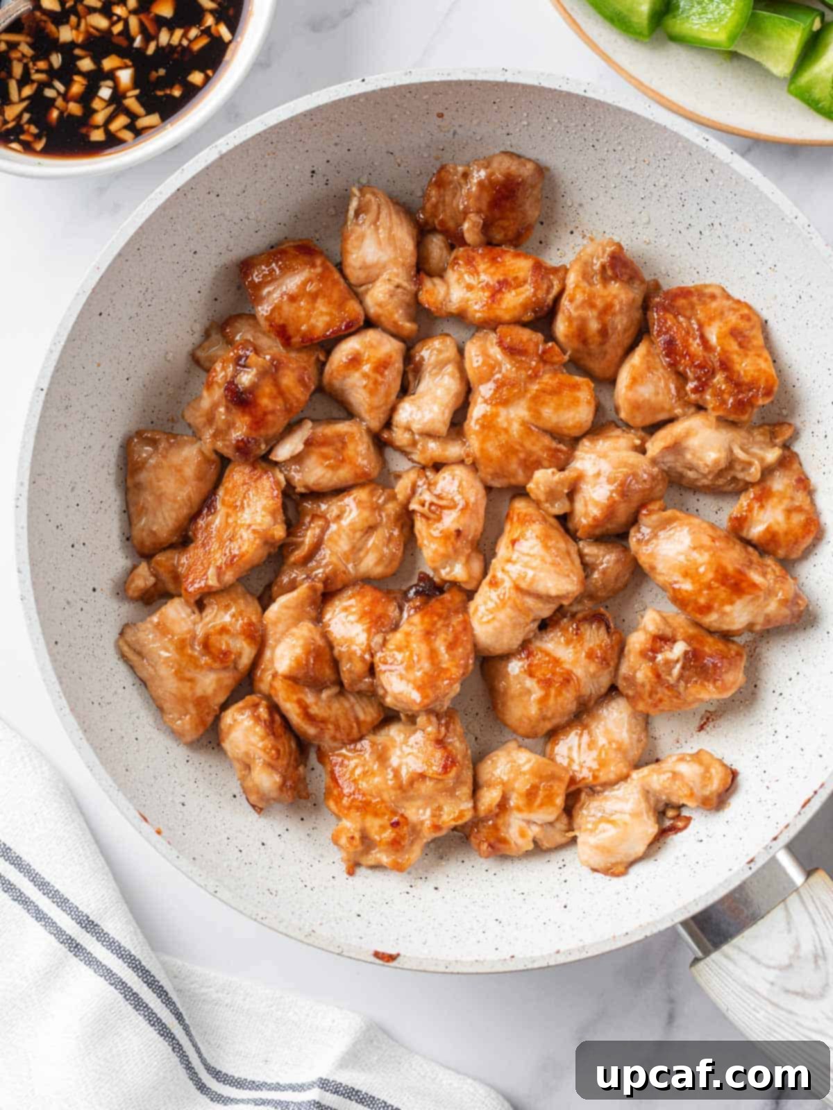 Original Sichuan Kung Pao 6 Chicken pan seared in a pan.