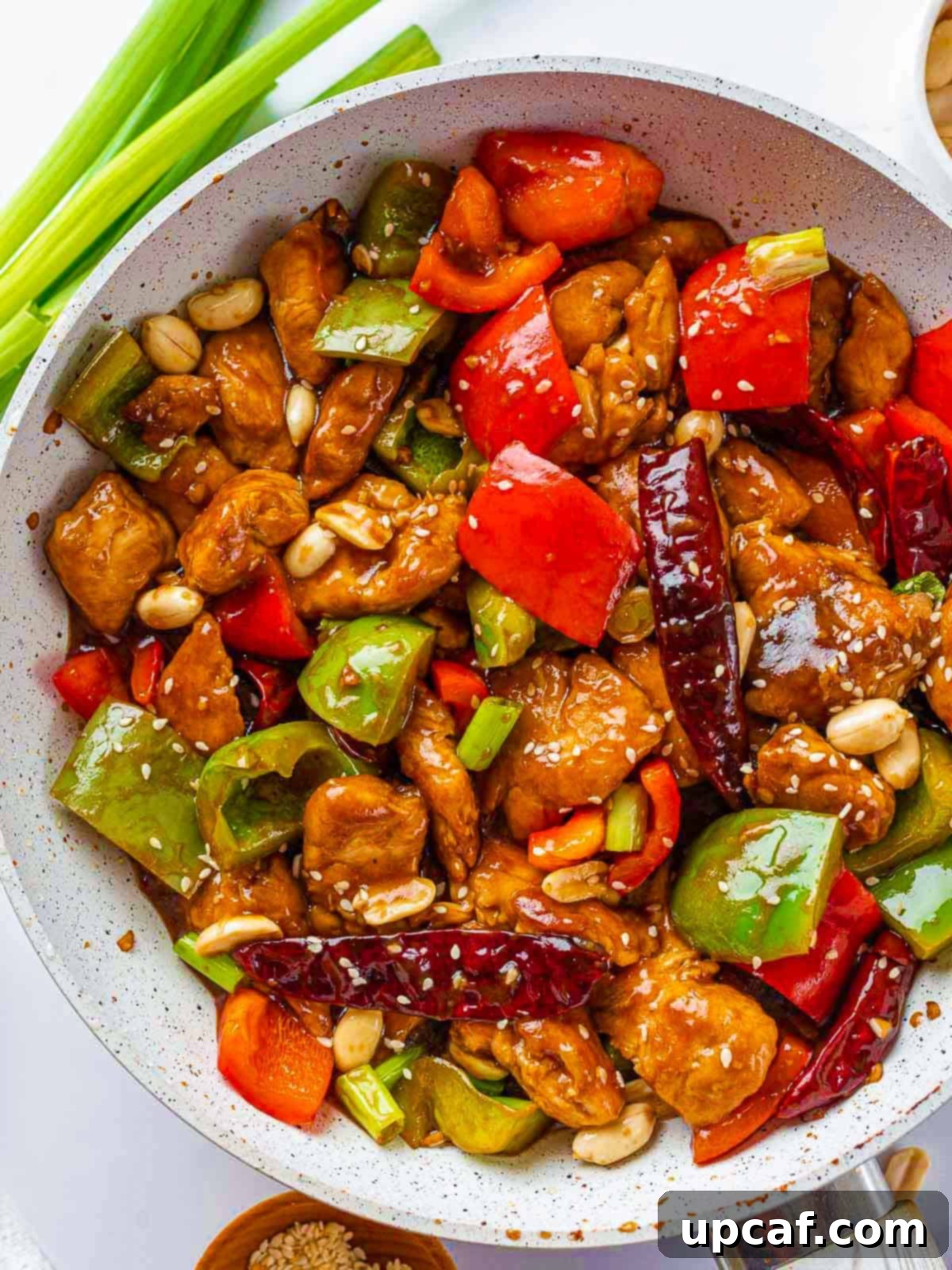 Original Sichuan Kung Pao 9 Close up of kung pao chicken in a pan.