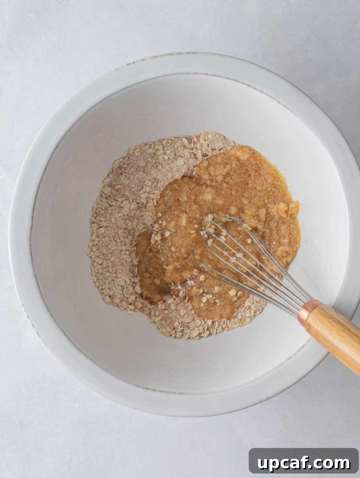 Cozy Apple Pie Cinnamon Oat Cookies 4 Wet and dry ingredients mixed together in separate bowls, ready to be combined.