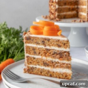 slice of carrot cake on a plate with a fork