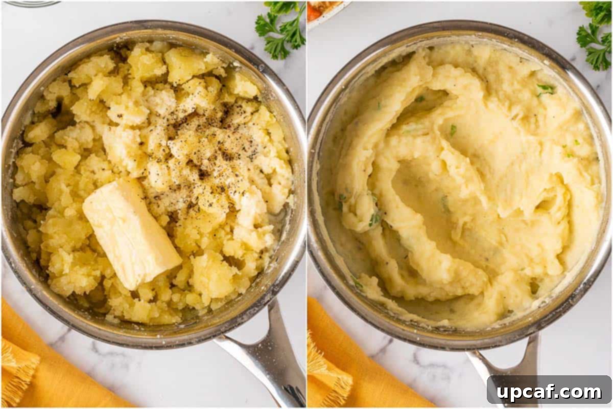 Mashing cooked potatoes in a pot with butter and cream to create a smooth, creamy topping for the shepherd's pie.