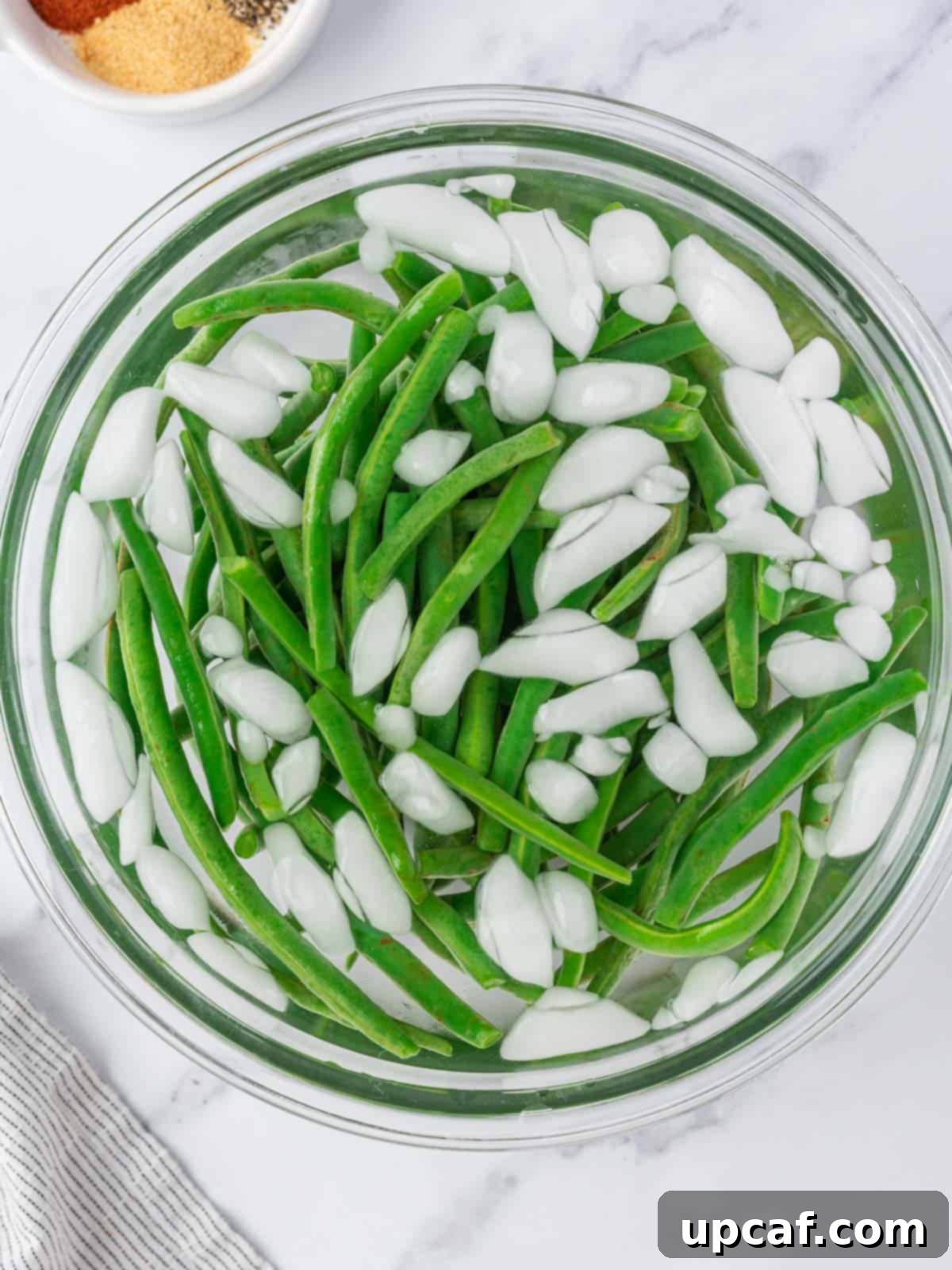 blanched green beans in iced water