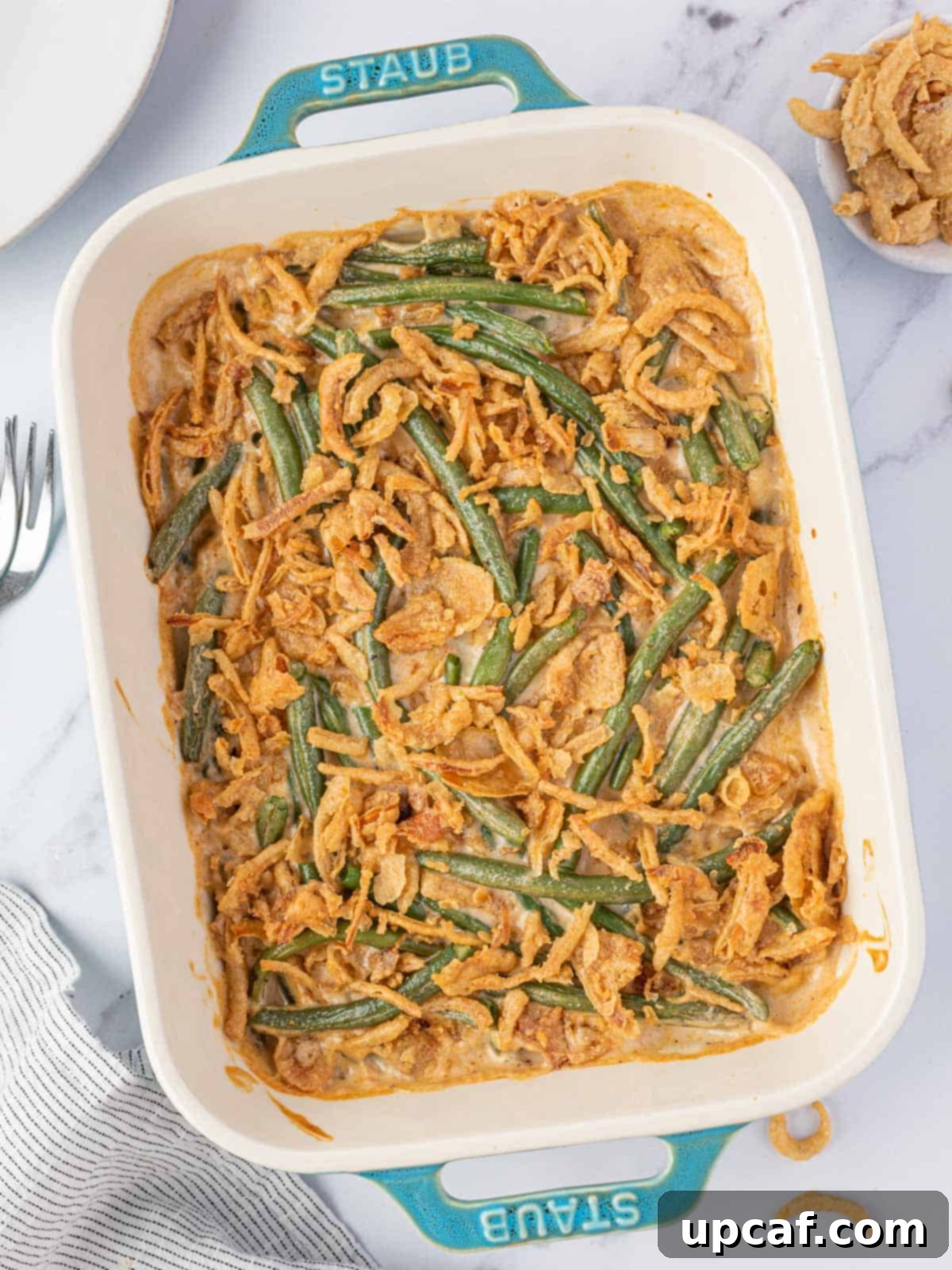 Cheesy Green Bean Casserole in white baking dish