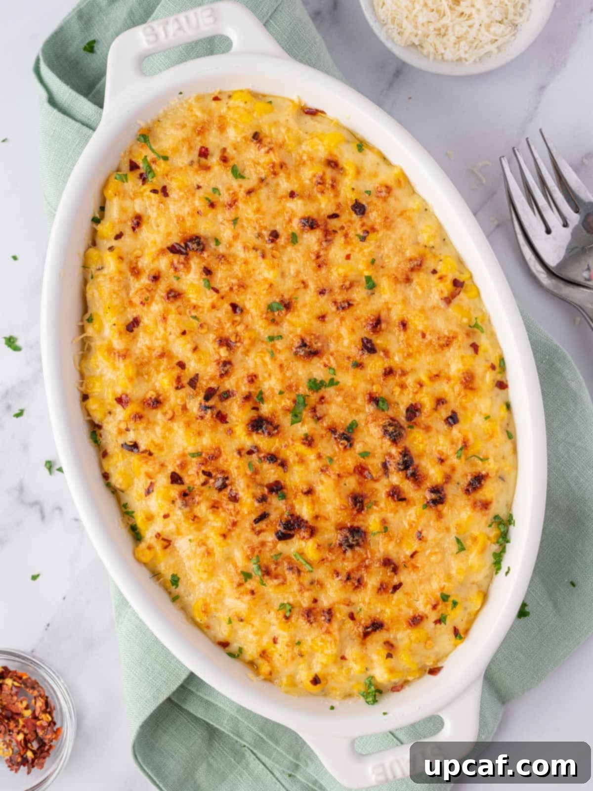 top down shot of the creamed corn casserole, garnished with parsley