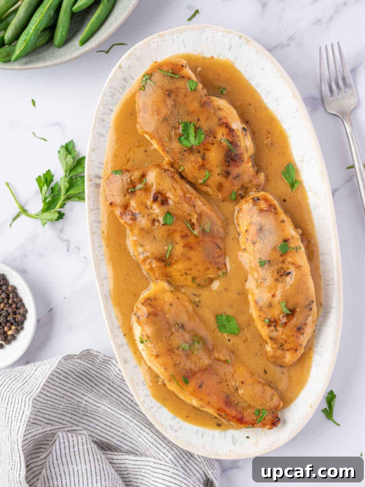 Effortless Chicken and Savory Gravy 9 A beautifully arranged platter showcasing the chicken and gravy, ready for family style serving.