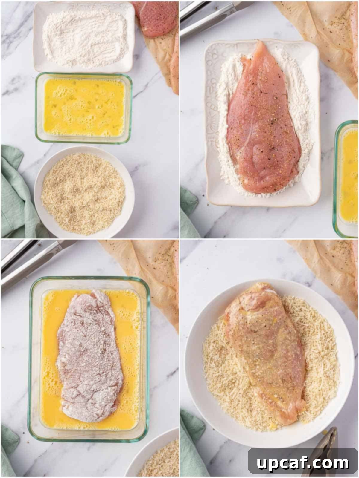 A chicken breast being coated in a breading mixture in a bowl.