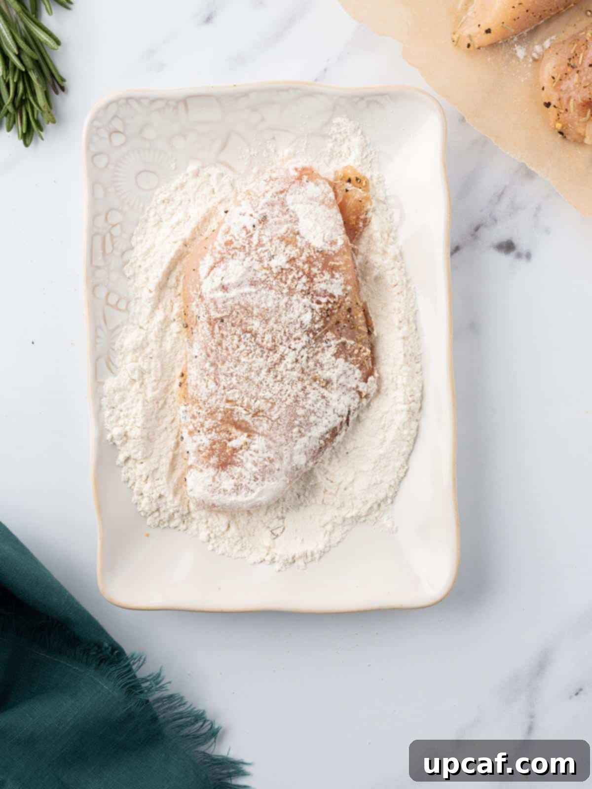 Seasoned chicken dredged in all-purpose flour.