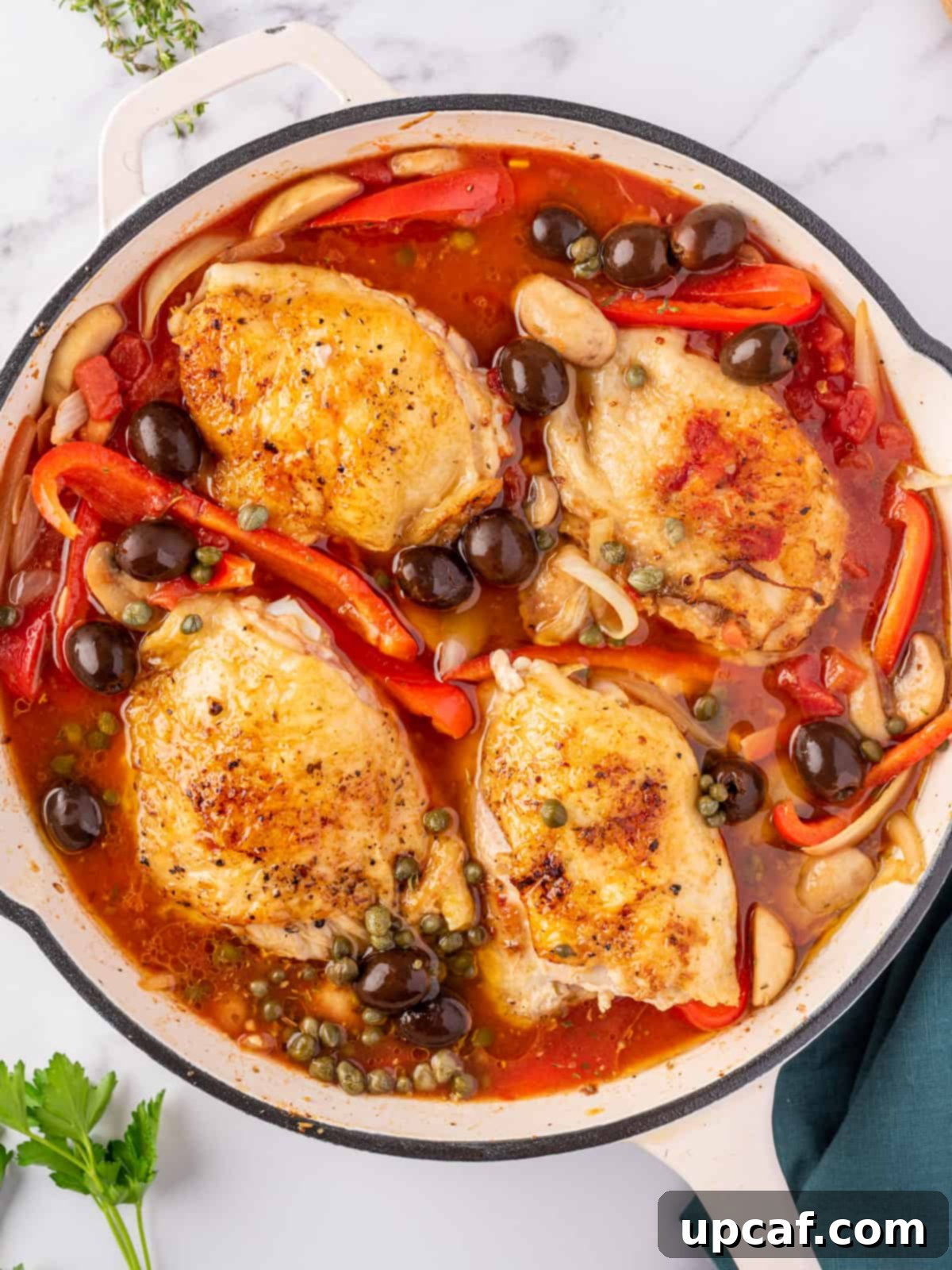 Chicken cacciatore cooked to perfection and ready to be served from the skillet.