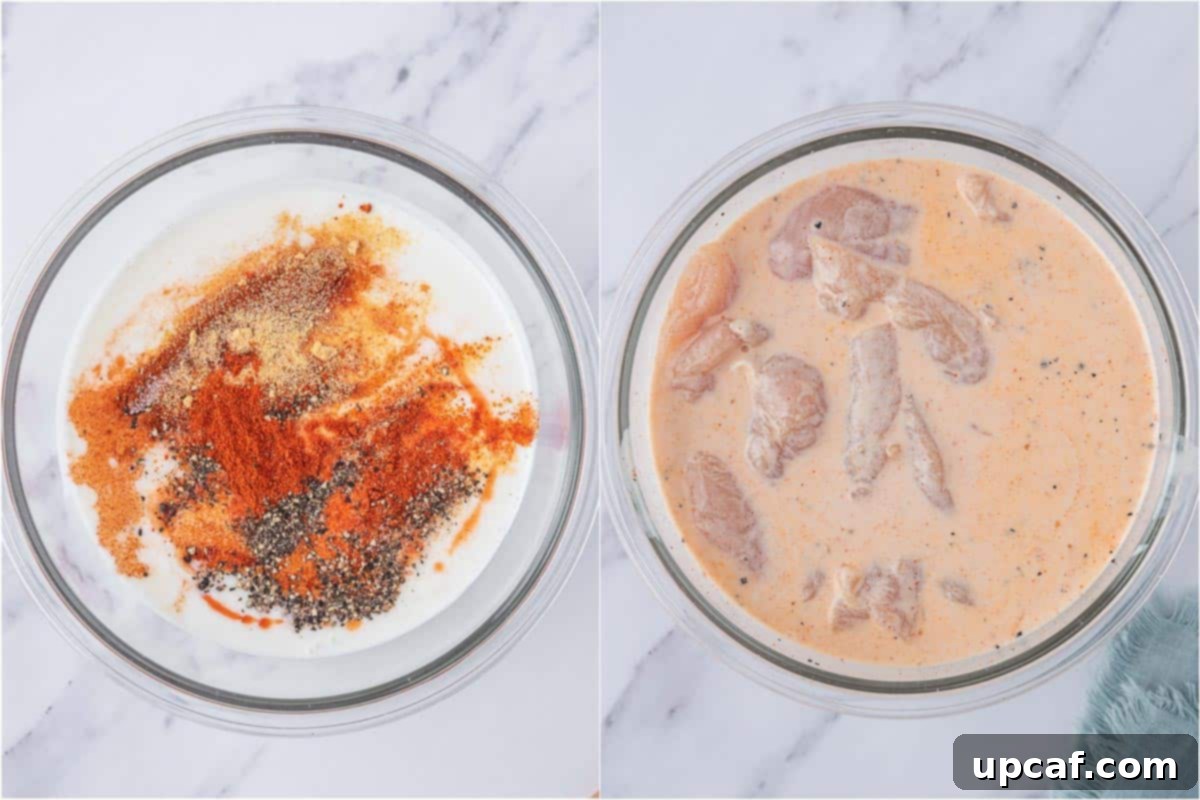 KFC's Fiery Nashville Chicken Tenders 4 Raw chicken tenders marinating in a buttermilk mixture in a bowl.