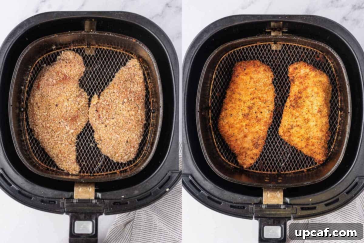Crispy chicken cutlets cooking in an air fryer basket, showing a golden crust.