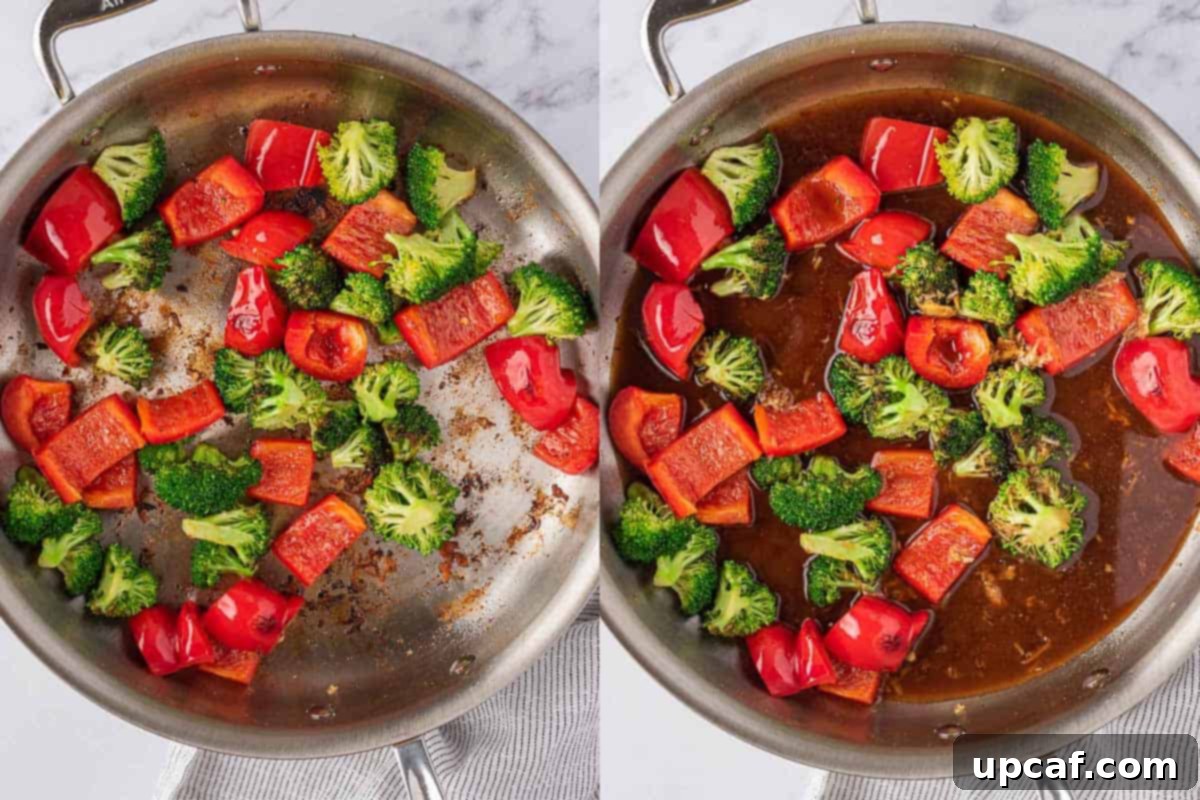 Vibrant stir-fry vegetables being cooked with chicken stir fry sauce in a large pan.