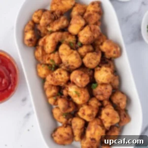 Homemade popcorn chicken on a platter for feeding a crowd.