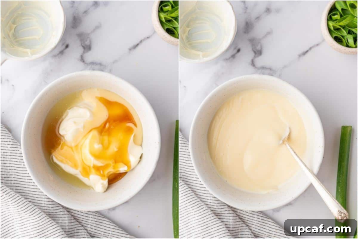 Ingredients for the honey walnut shrimp sauce - mayonnaise, condensed milk, honey, and lemon juice - being whisked together in a bowl.