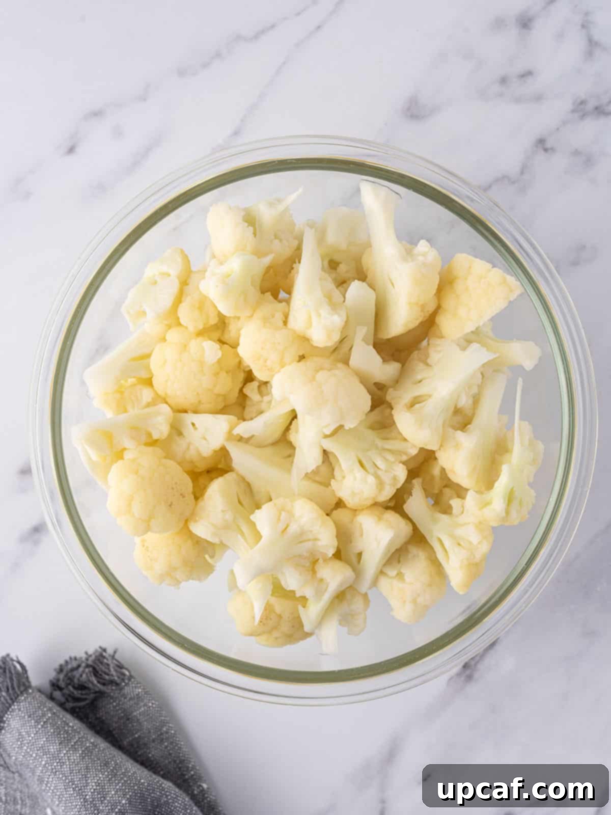 Cheesy Keto Cauliflower Bake 4 Cooked cauliflower florets in a bowl.