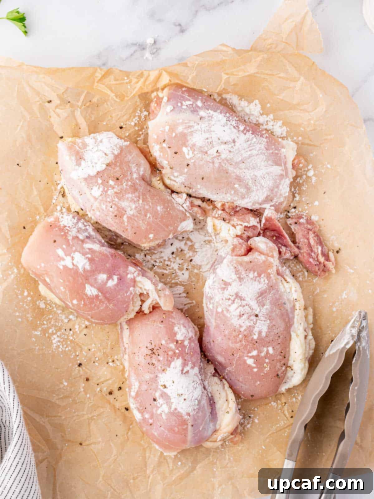 Chicken coated in cornstarch, salt, and pepper.