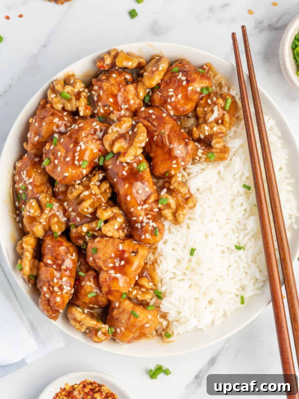 Caramelized Honey Walnut Chicken 2 honey walnut chicken served over rice.