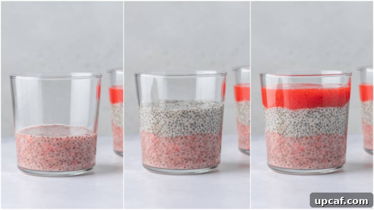 Creamy Strawberry Chia Pudding 5 A glass being filled with layers of strawberry and plain chia pudding, demonstrating the process of assembly for the layered dessert.