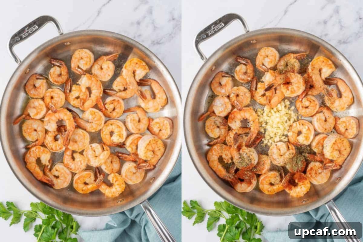 Shrimp cooking in a skillet with olive oil for the garlic lemon shrimp recipe.