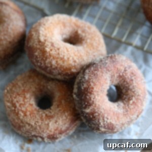 batch of donuts on parchment.
