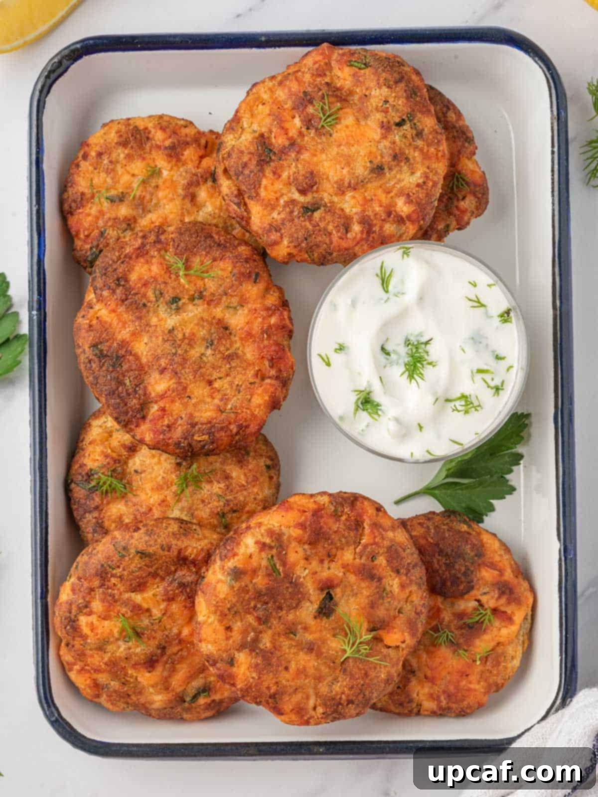 Fresh salmon patties recipe on a tray for serving.