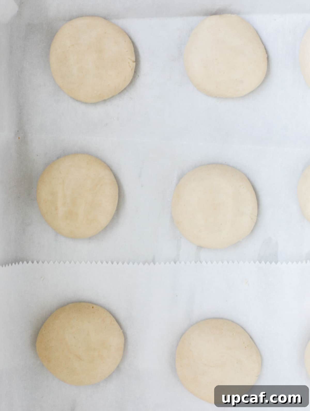 ghraybeh cookies in a sheet pan before finger indent