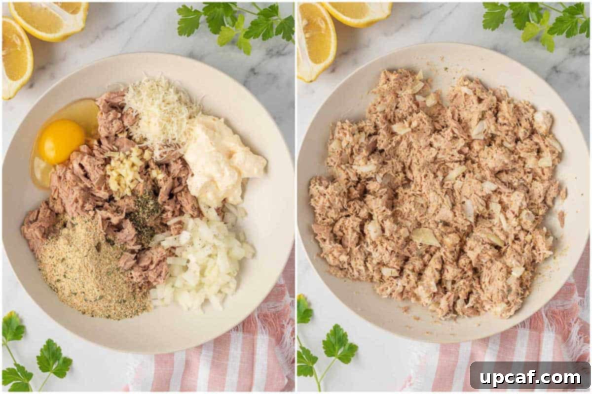 Close-up of a large bowl showing a mixture of tuna, parmesan cheese, bread crumbs, onion, mayonnaise, lemon juice, garlic, parsley, salt, black pepper and egg, being mixed to form air fryer tuna patties.